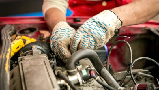 Mechanic working in auto repair garage. Car maintenance
